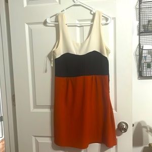 Cute color lock dress. Comfy stretchy fabric. Pretty worn, has light staining